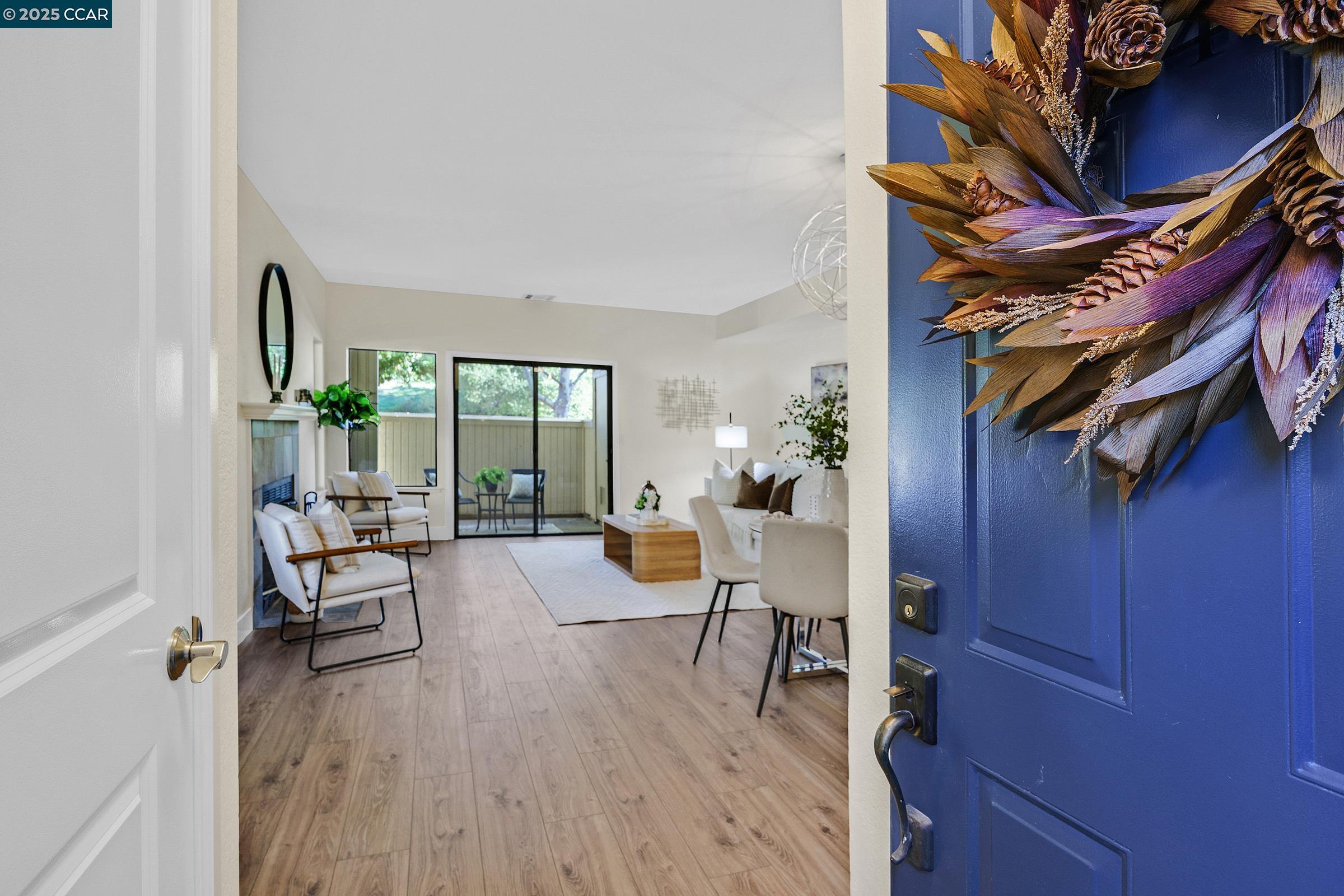 246 Copper Ridge Road San Ramon, CA 94582 - Photo 2 of 41 a living room with furniture and wooden floor