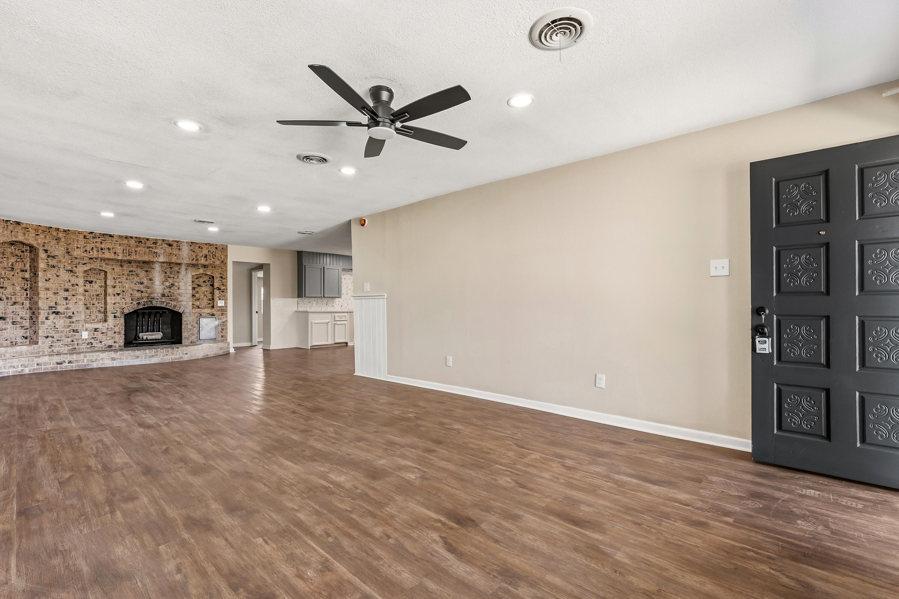 5015 16th Street Lubbock, TX 79416 - Photo 4 of 27 a view of empty room with wooden floor and window