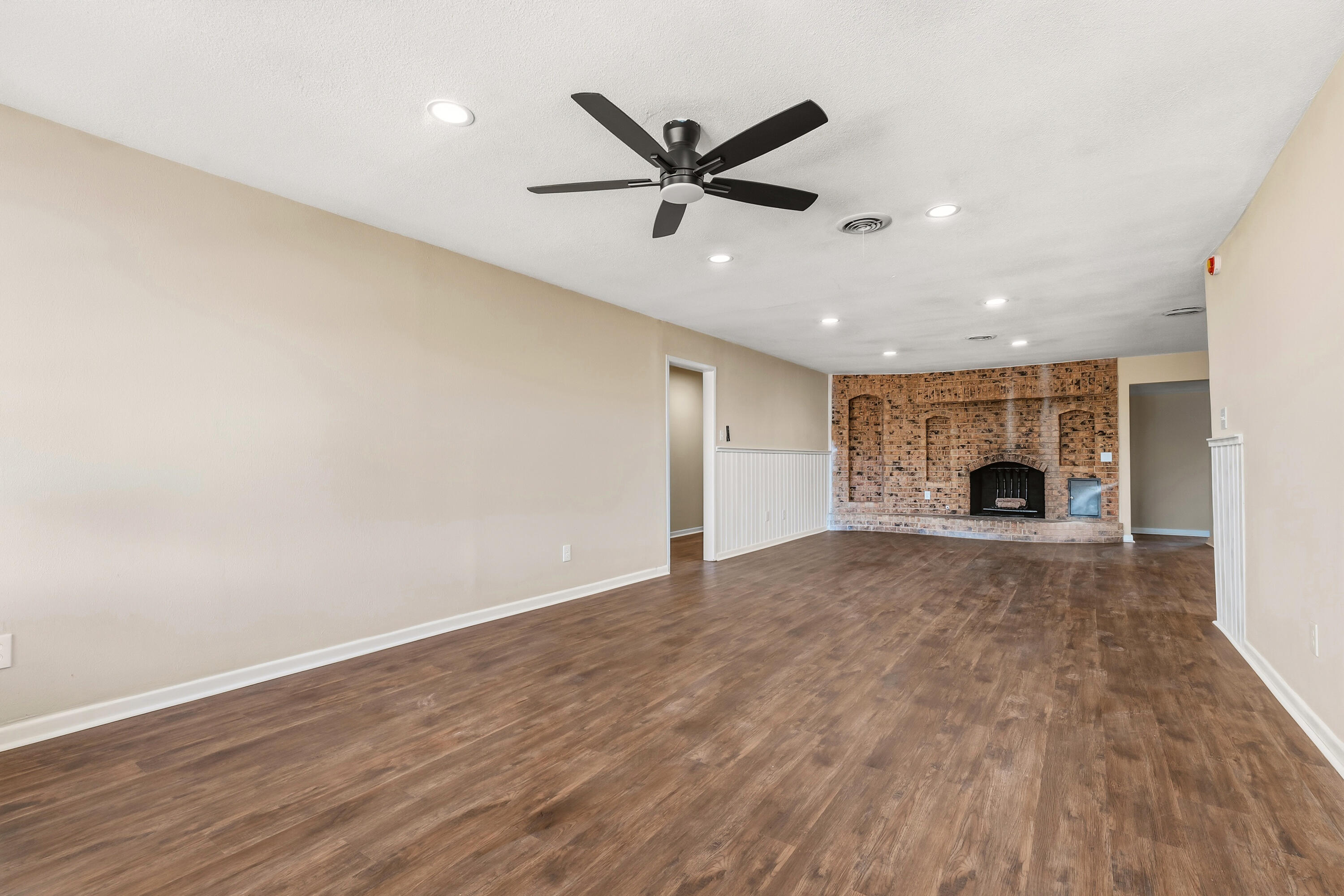 5015 16th Street Lubbock, TX 79416 - Photo 5 of 27 a view of an empty room with a fireplace