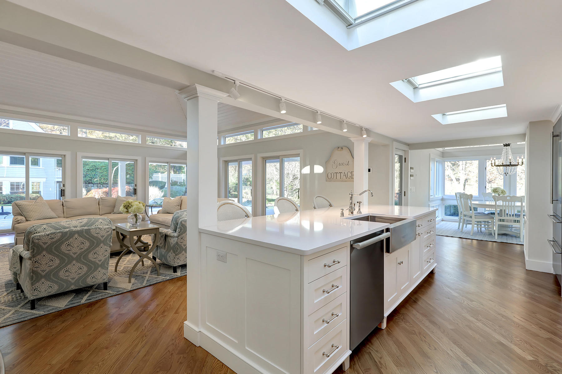 125 Greensward Road Mashpee, MA 02649 - Photo 14 of 60 a large white kitchen with a large window