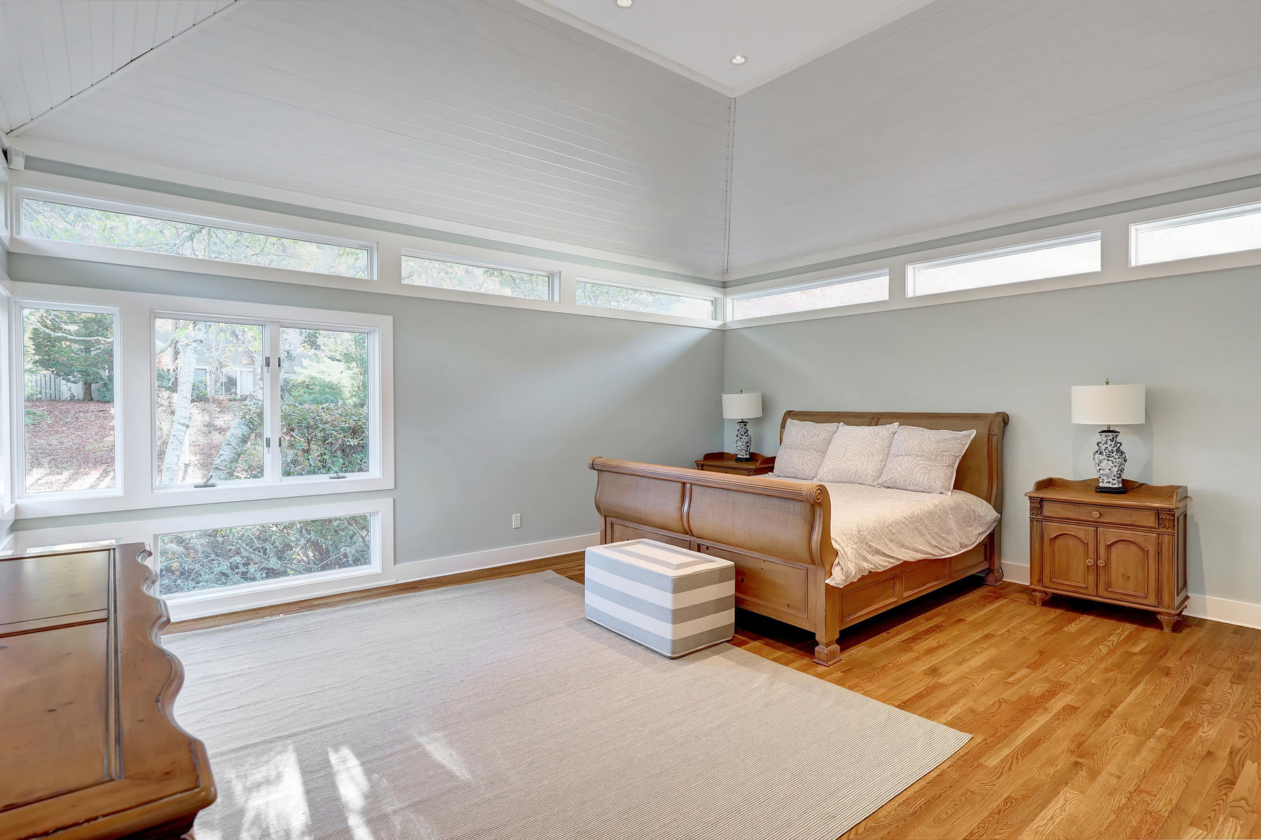 125 Greensward Road Mashpee, MA 02649 - Photo 17 of 60 a bedroom with a large bed and wooden floor