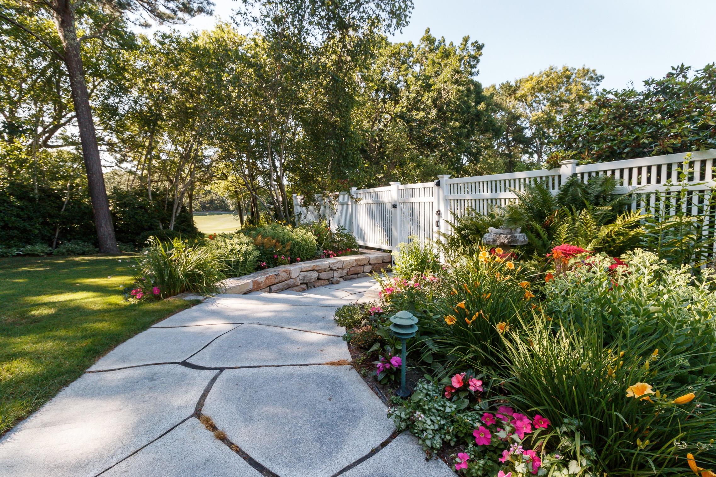 125 Greensward Road Mashpee, MA 02649 - Photo 31 of 60 a view of a garden with flowers