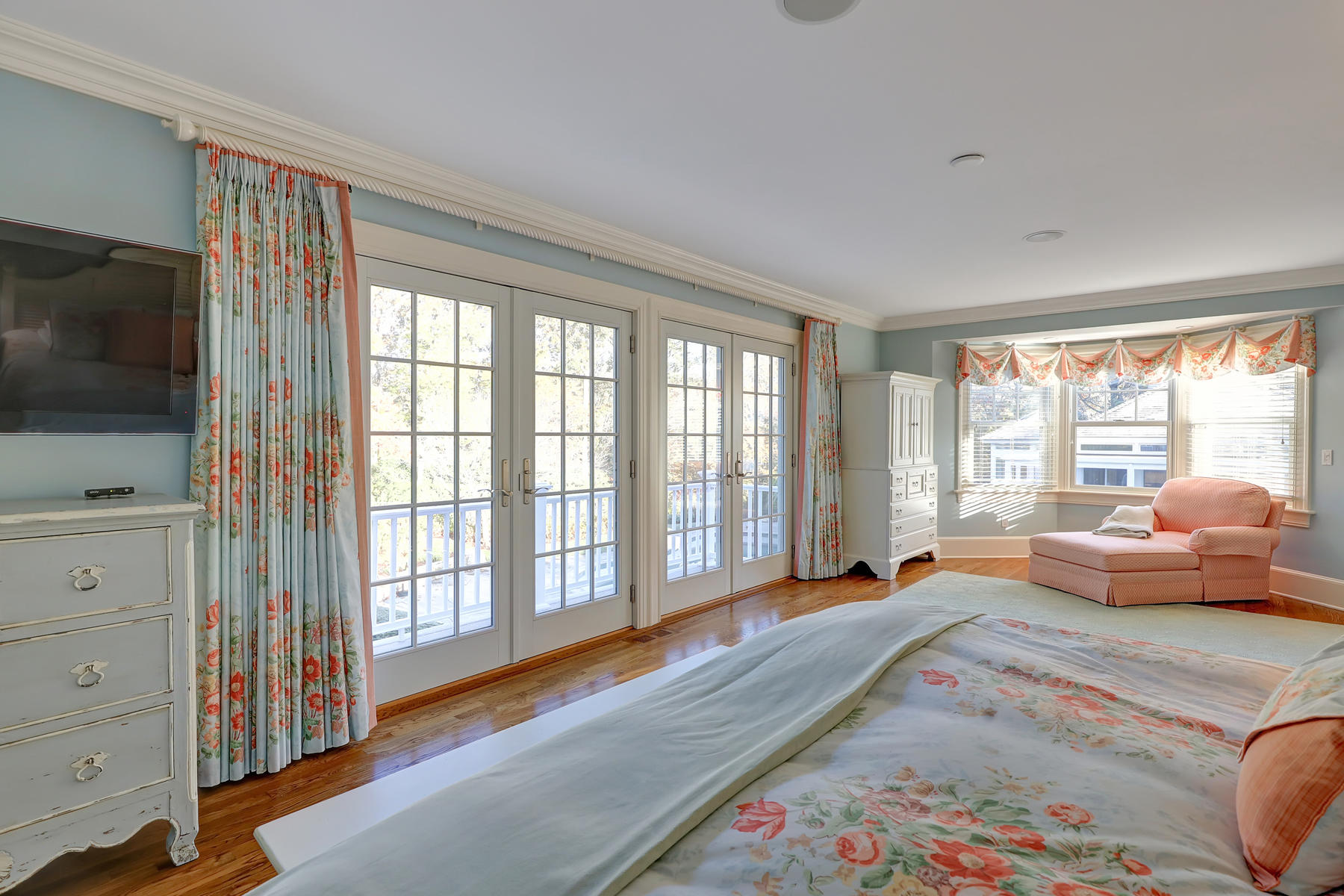 125 Greensward Road Mashpee, MA 02649 - Photo 40 of 60 a bedroom with furniture and large windows