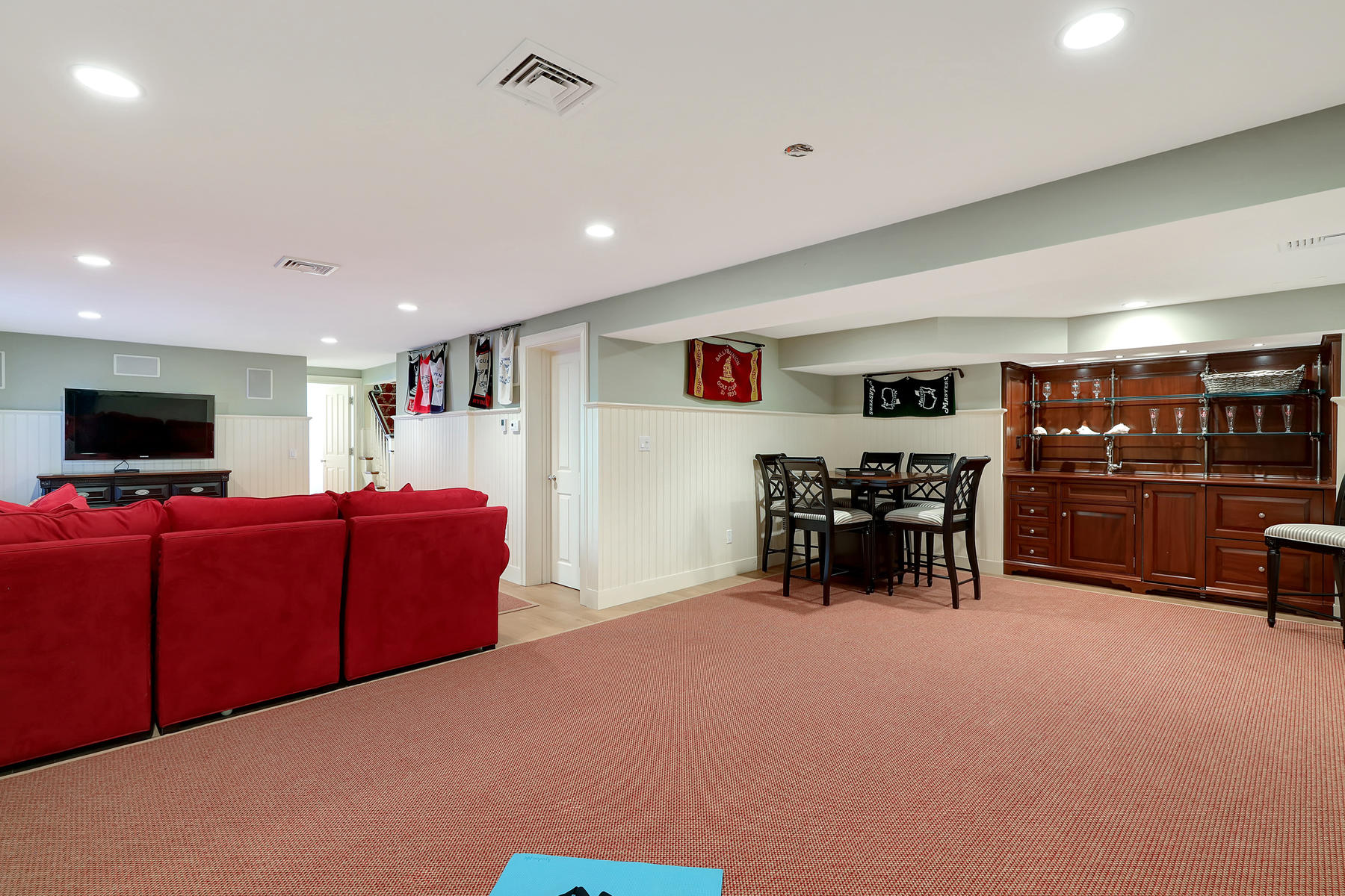 125 Greensward Road Mashpee, MA 02649 - Photo 48 of 60 a living room with furniture and a flat screen tv