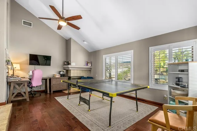 a kitchen with stainless steel appliances granite countertop a stove top oven a refrigerator and a sink