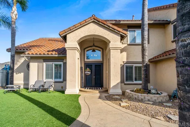 a view of entryway and hall with a living room