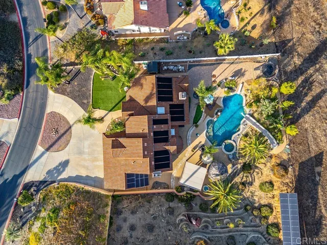 an aerial view of residential house and sandy dunes