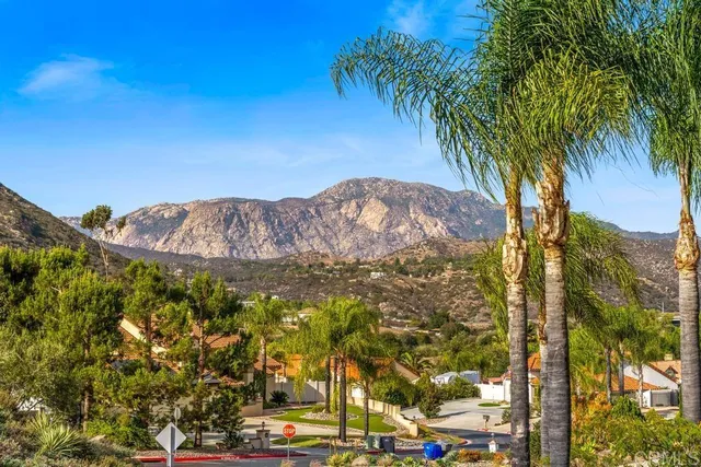an aerial view of residential house and sandy dunes