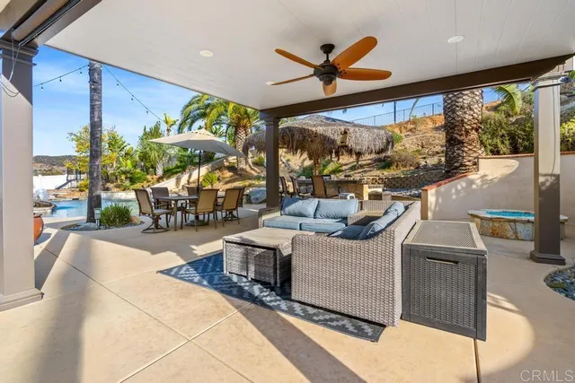 a backyard of a house with outdoor seating