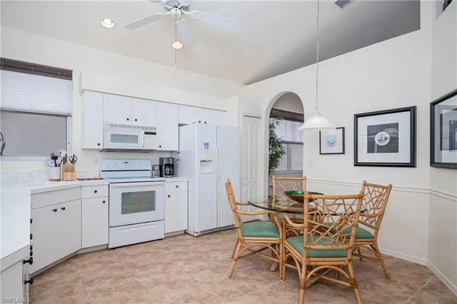 a view of kitchen with furniture and wooden floor