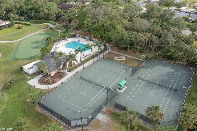 a view of a patio with a table and chairs