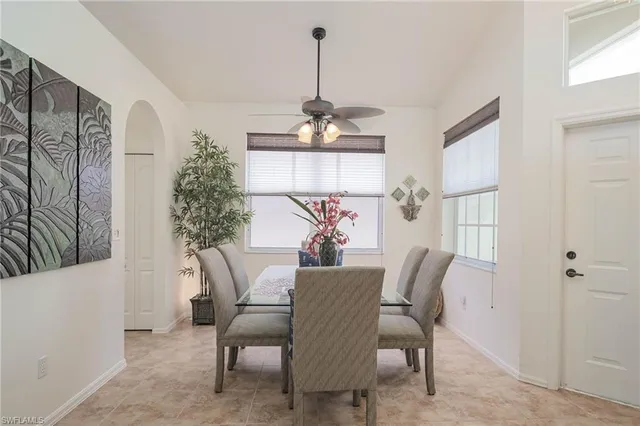 a dining room with furniture and window