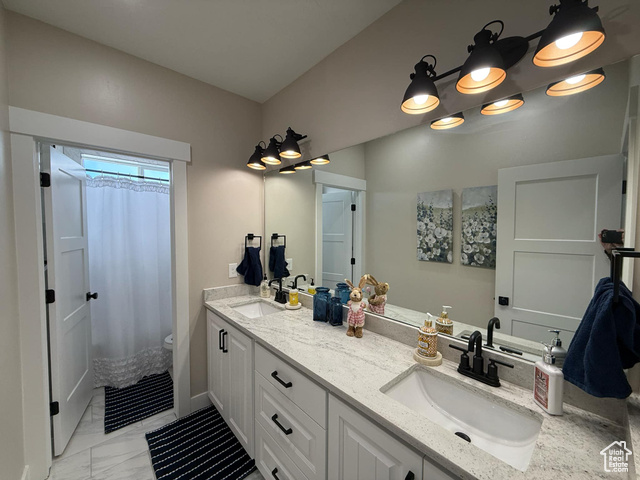 1240 West 2360 North Helper, UT 84526 - Photo 65 of 79 Bathroom with a shower with curtain, marble finish floor, a sink, and double vanity