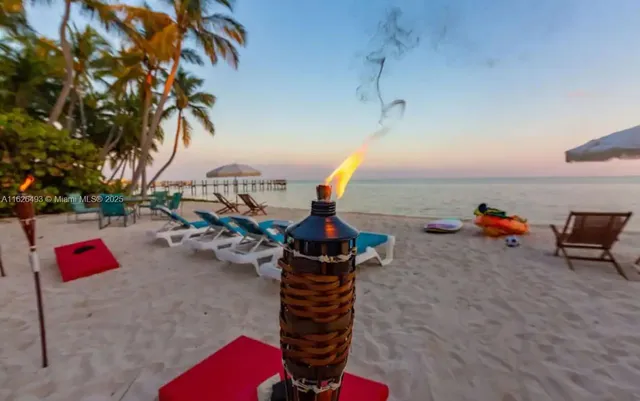 a view of a swimming pool with an outdoor space and seating area