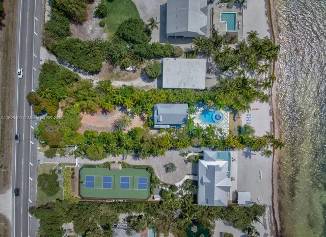 a bedroom with a bed and a view of living room