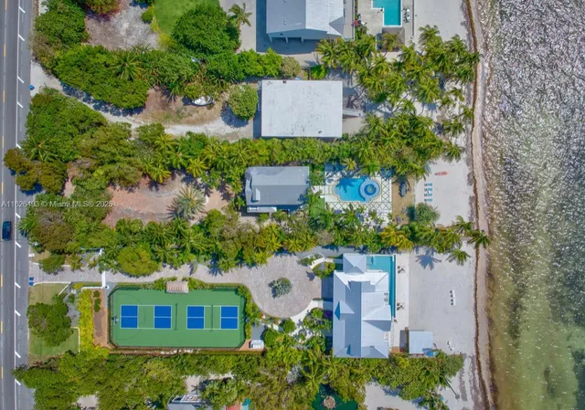 a large kitchen with stainless steel appliances lots of counter space and a sink