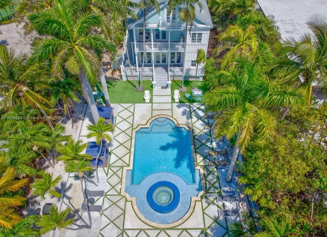 a view of a swimming pool with lounge chair