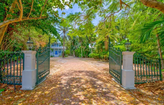 a view of a house with swimming pool and sitting area