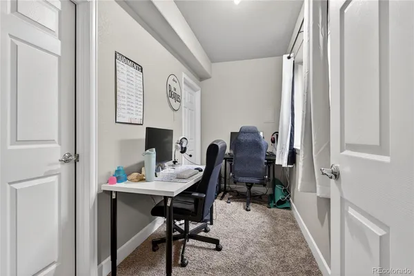 a workspace with furniture and a window