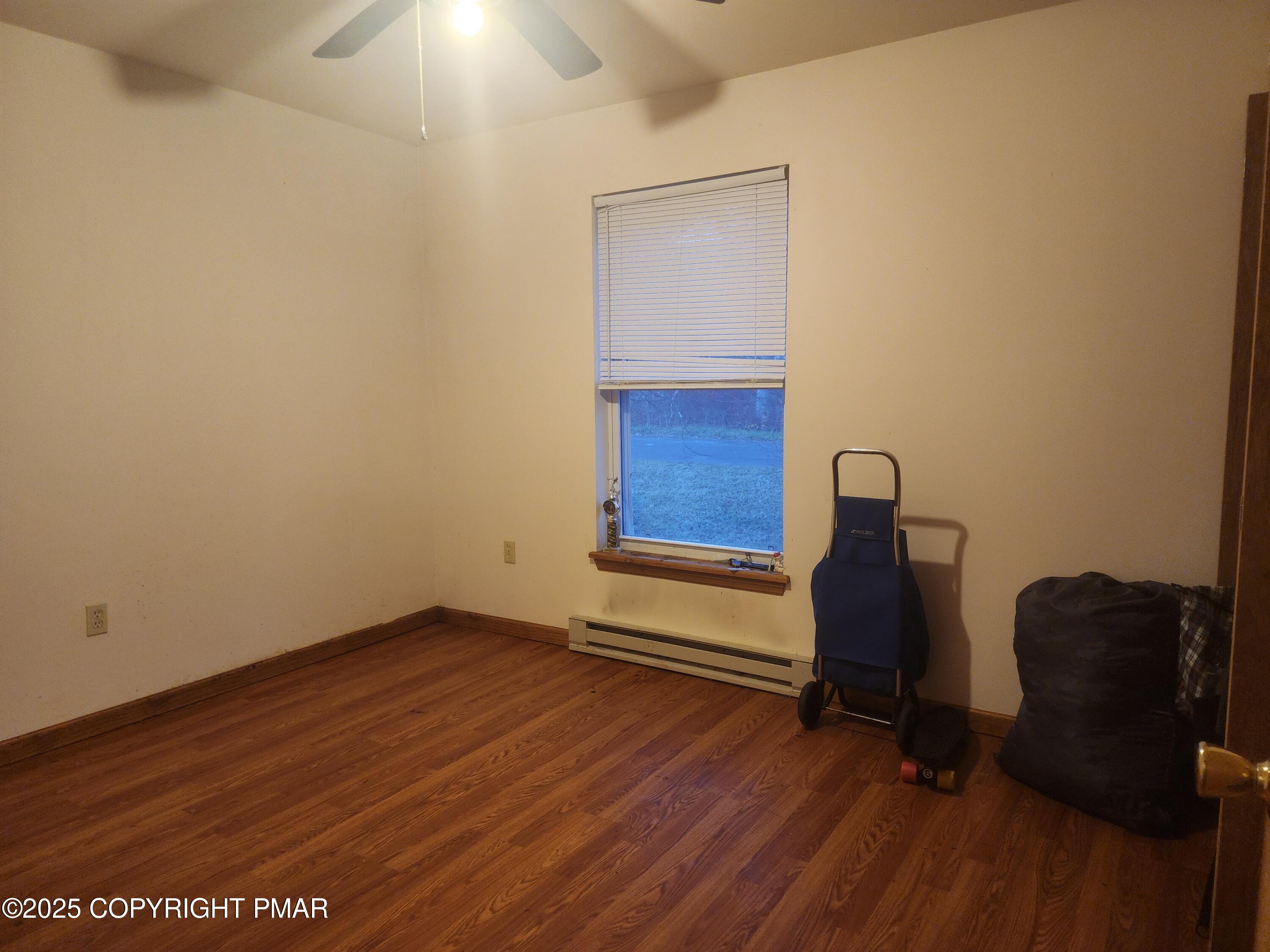 195 Williams Lane Scotrun, PA 18355 - Photo 12 of 17 a view of workspace with wooden floor and windows