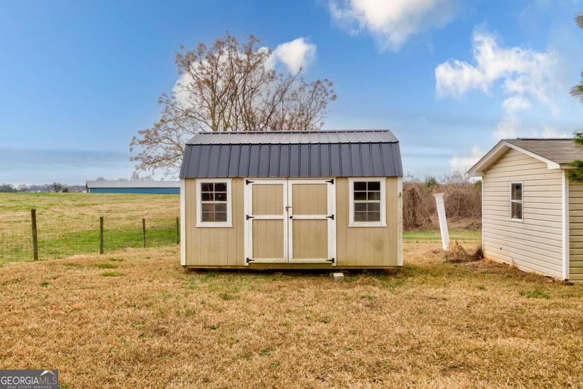665 Caney Branch Road Lavonia, GA 30553 - Photo 12 of 26 a view of a house with a balcony