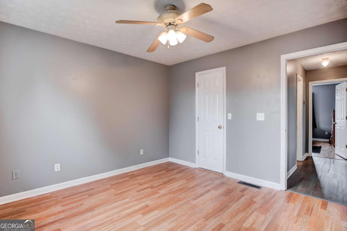 665 Caney Branch Road Lavonia, GA 30553 - Photo 20 of 26 a view of a room with a sink and a chandelier fan