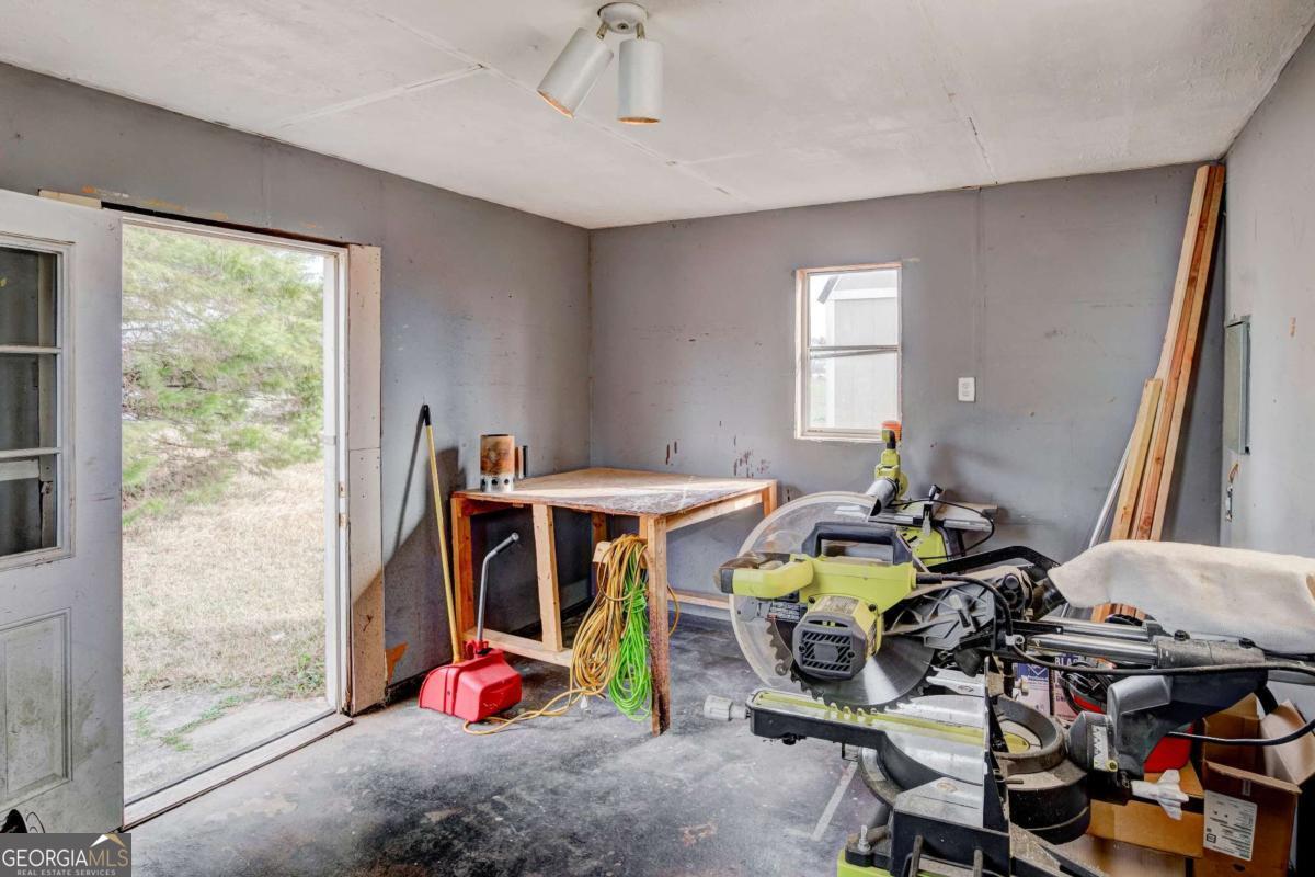 665 Caney Branch Road Lavonia, GA 30553 - Photo 25 of 26 a bedroom with furniture and gym equipment