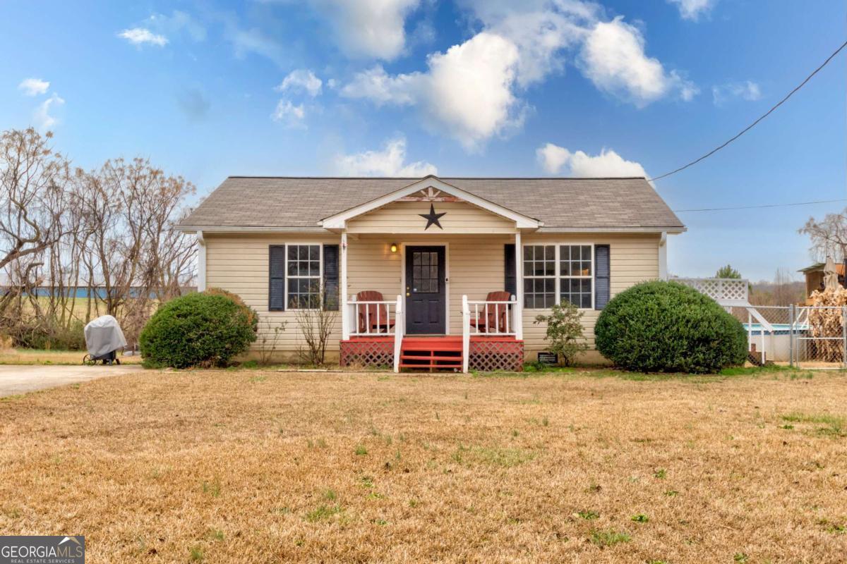 665 Caney Branch Road Lavonia, GA 30553 - Photo 6 of 26 a front view of a house with a yard