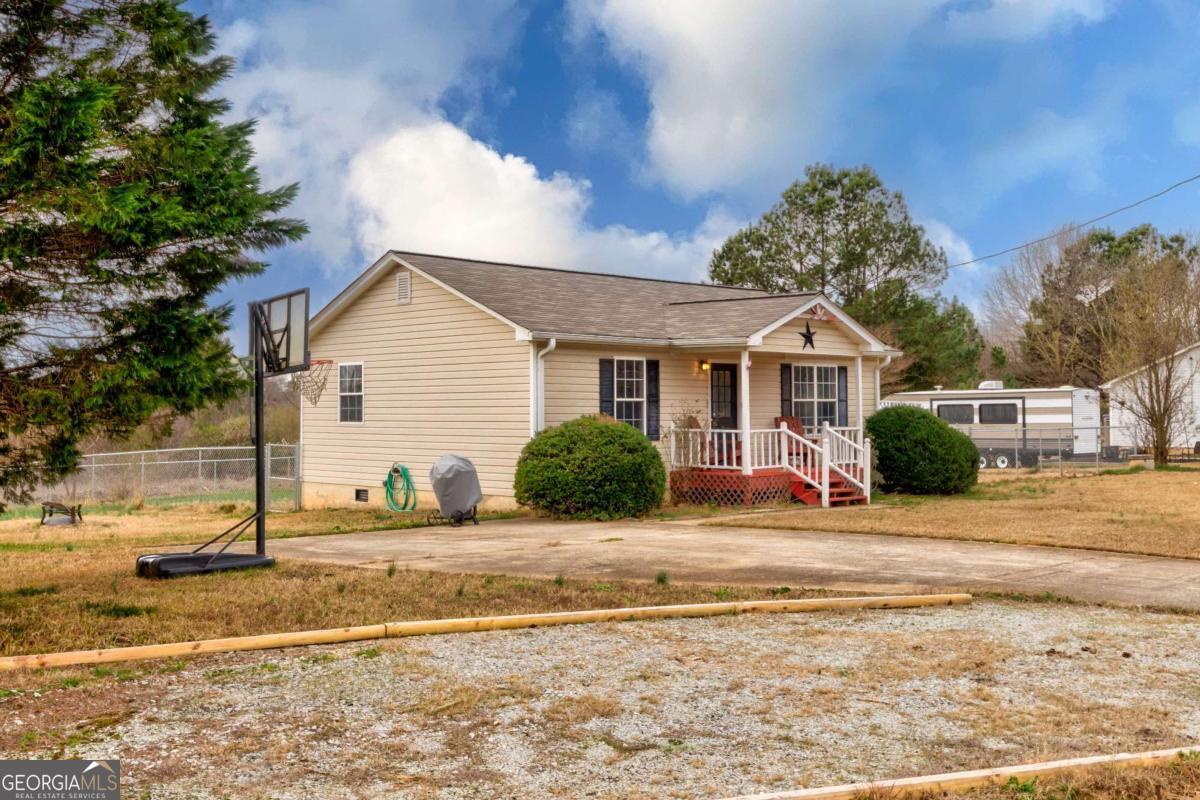 665 Caney Branch Road Lavonia, GA 30553 - Photo 7 of 26 a front view of a house with a yard