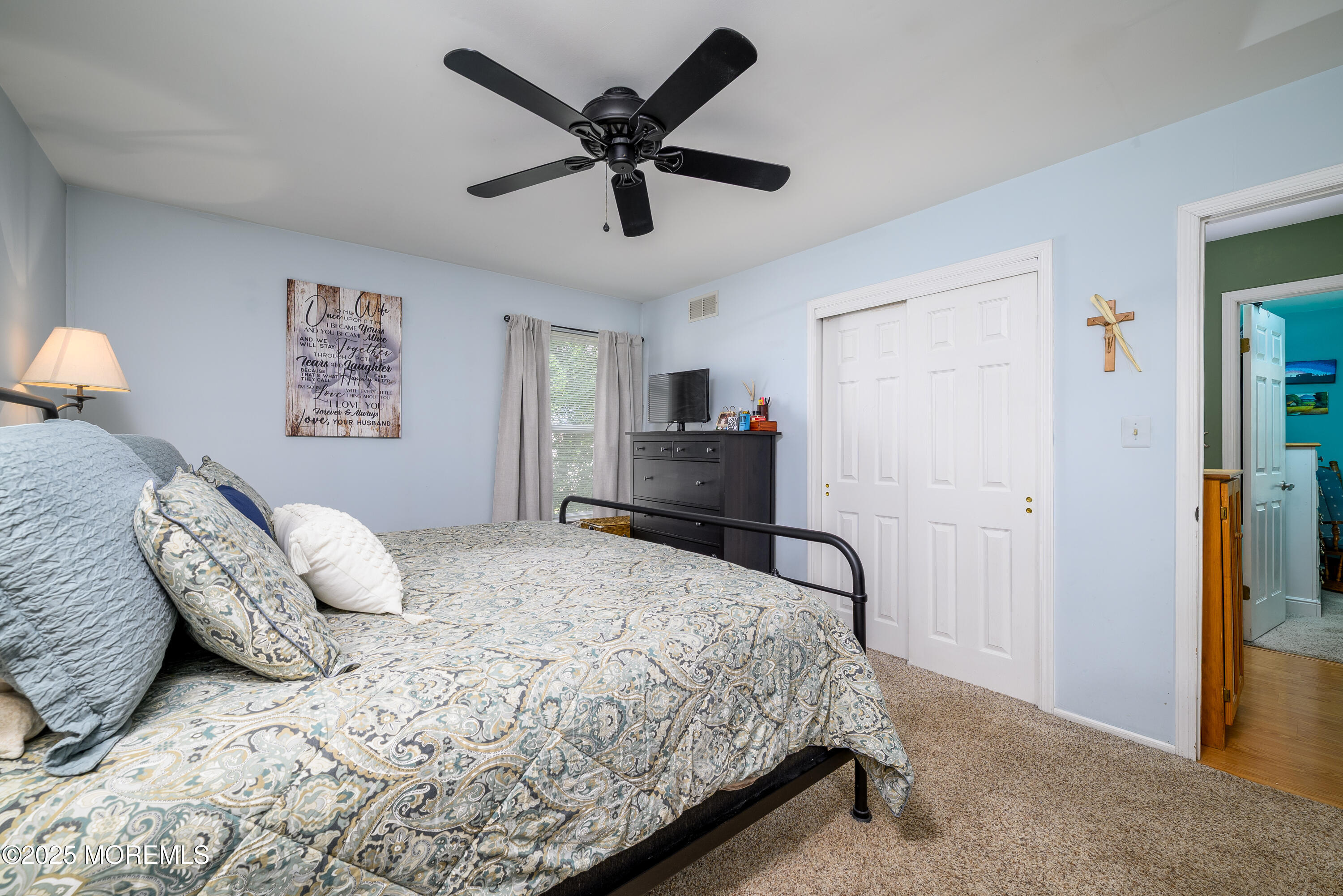 18 Fella Street Howell, NJ 07731 - Photo 14 of 35 a bedroom with a large bed and a ceiling fan