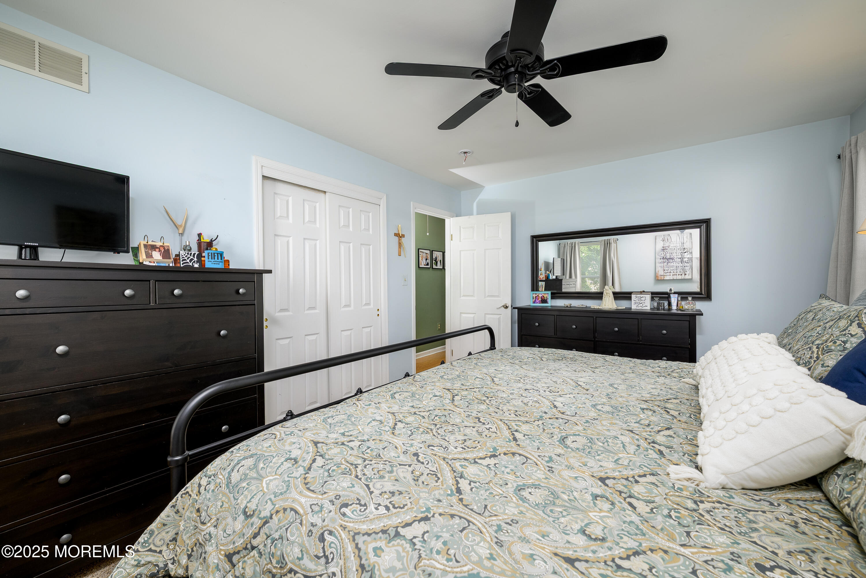 18 Fella Street Howell, NJ 07731 - Photo 15 of 35 a bedroom with a bed and a flat screen tv