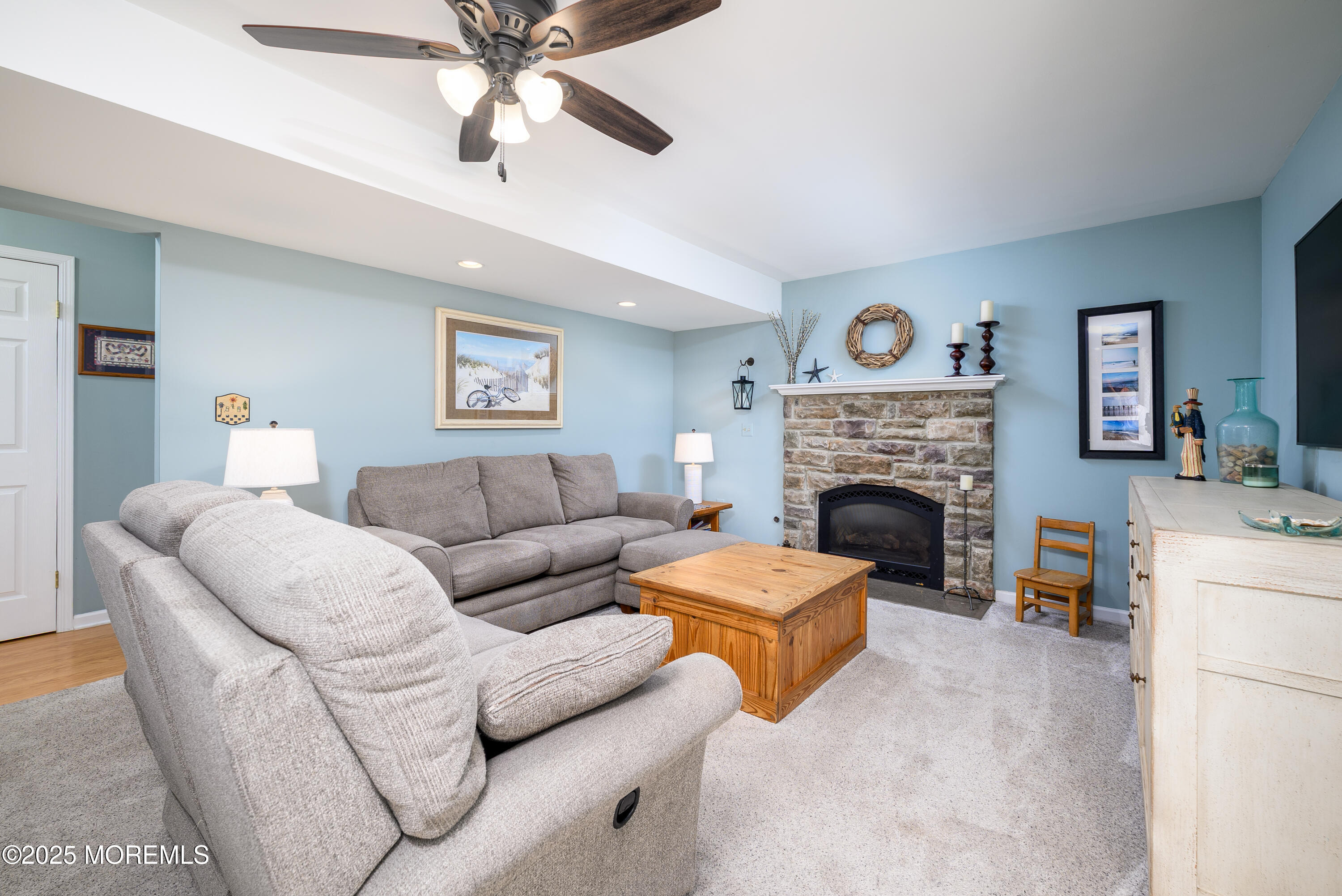 18 Fella Street Howell, NJ 07731 - Photo 19 of 35 a living room with furniture a fireplace and a flat screen tv