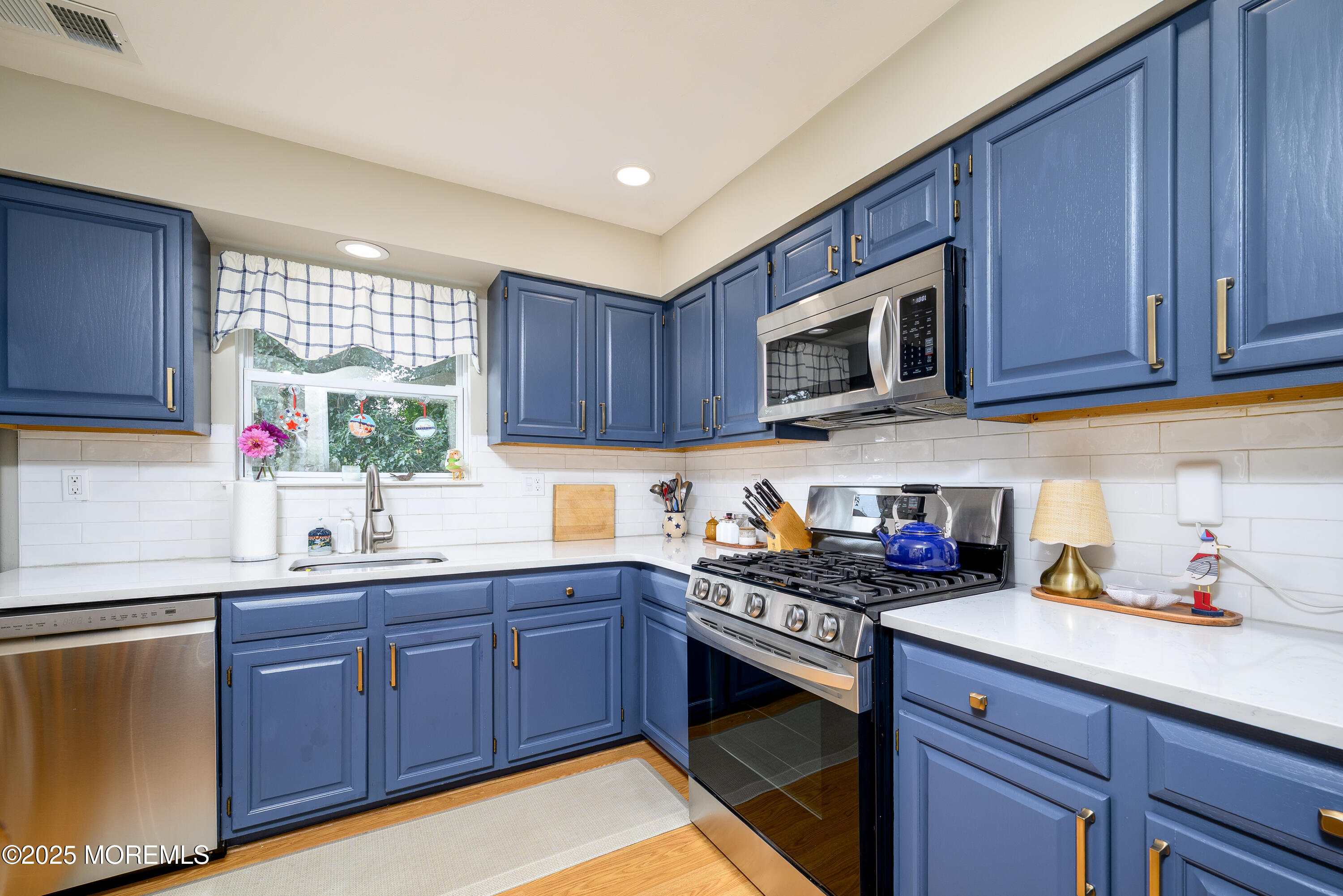 18 Fella Street Howell, NJ 07731 - Photo 9 of 35 a kitchen with granite countertop a sink cabinets and window