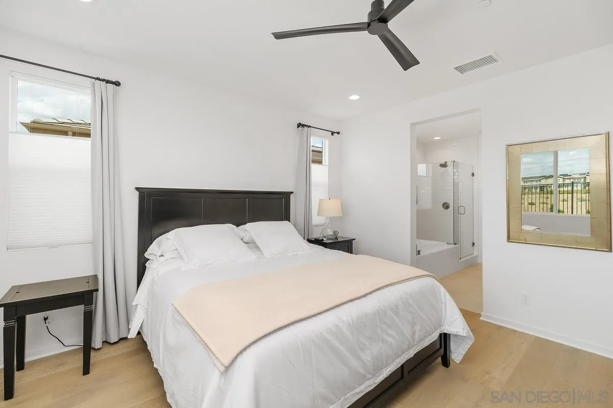 32082 Sedge Way Temecula, CA 92591 - Photo 16 of 59 a bedroom with a bed and painting on the wall