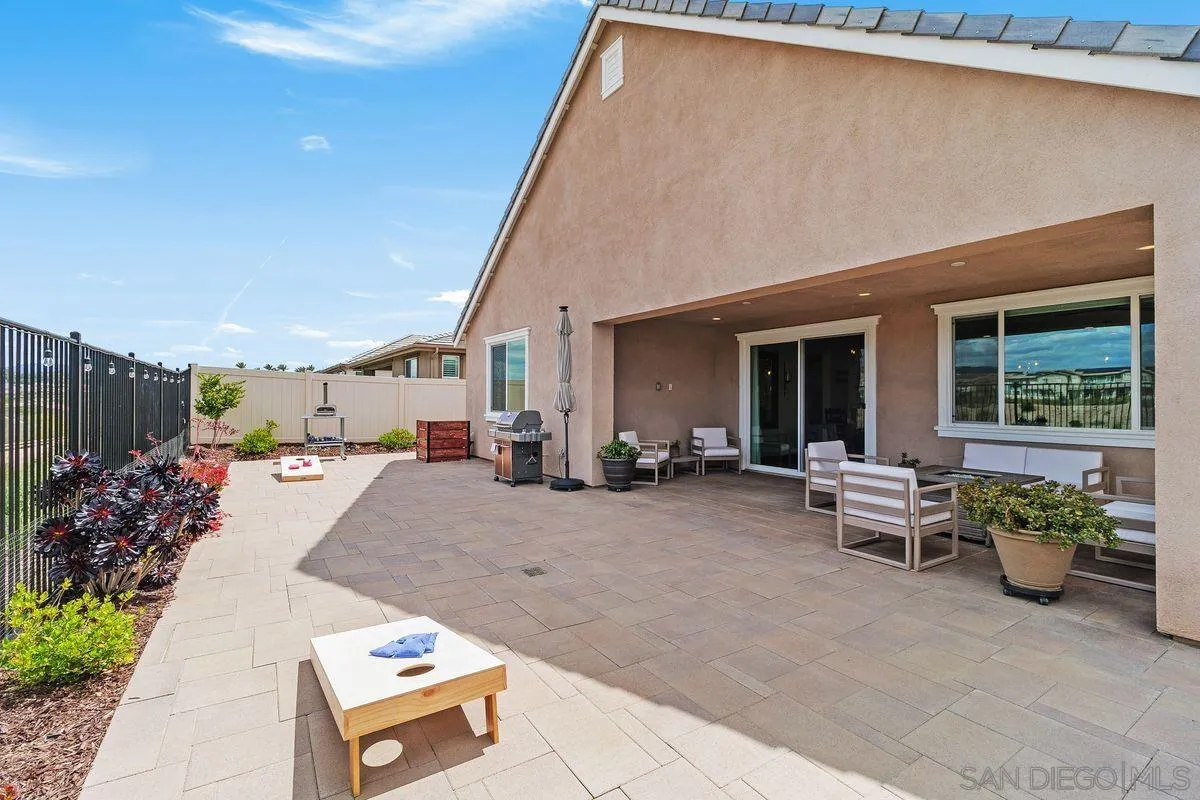 32082 Sedge Way Temecula, CA 92591 - Photo 23 of 59 a view of a patio with table and chairs and potted plants