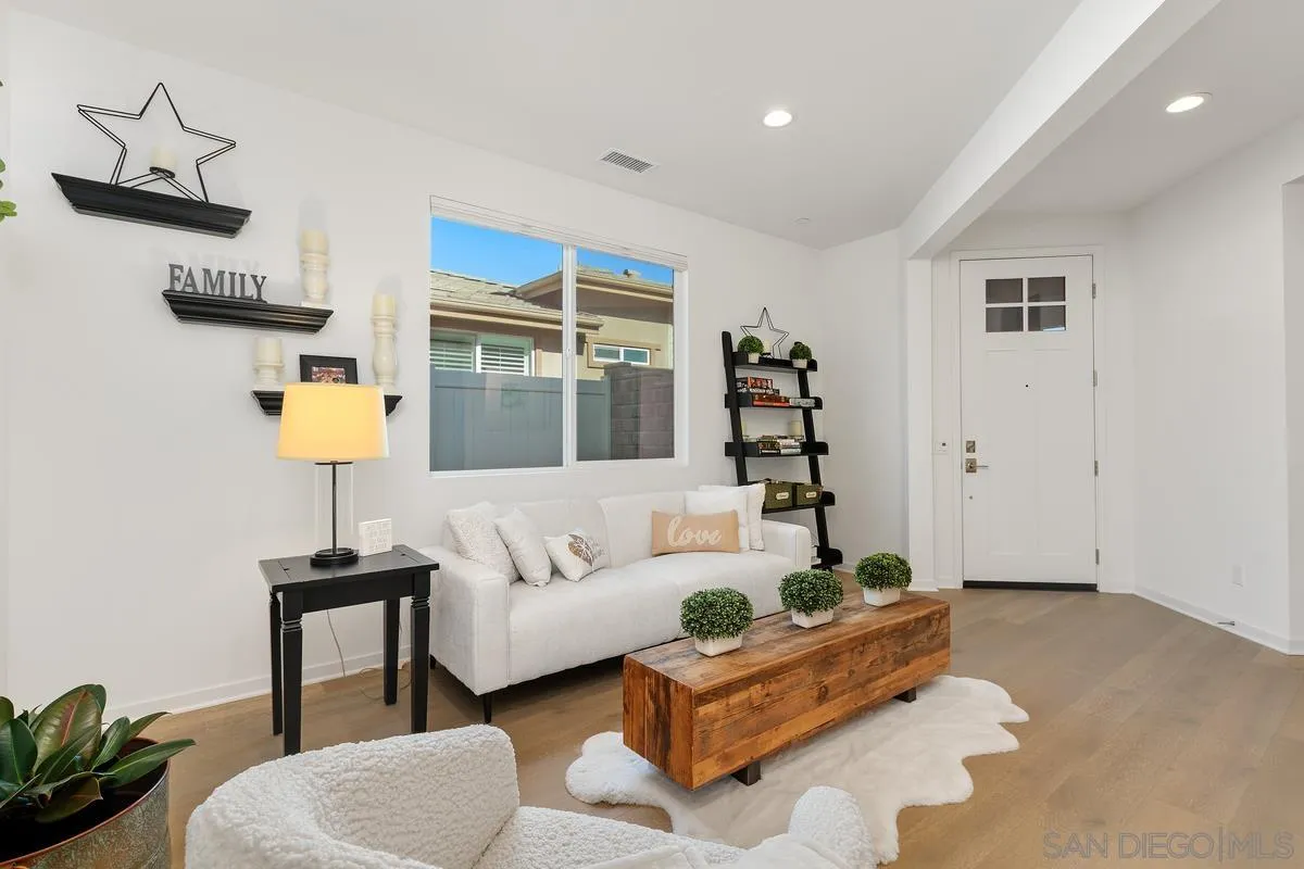32082 Sedge Way Temecula, CA 92591 - Photo 6 of 59 a living room with furniture and a lamp