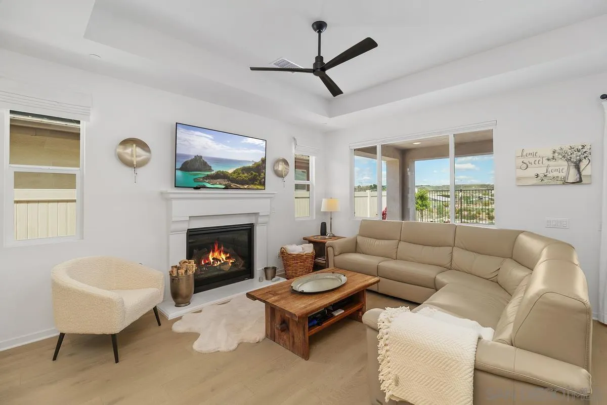 32082 Sedge Way Temecula, CA 92591 - Photo 8 of 59 a living room with furniture a fireplace and a window