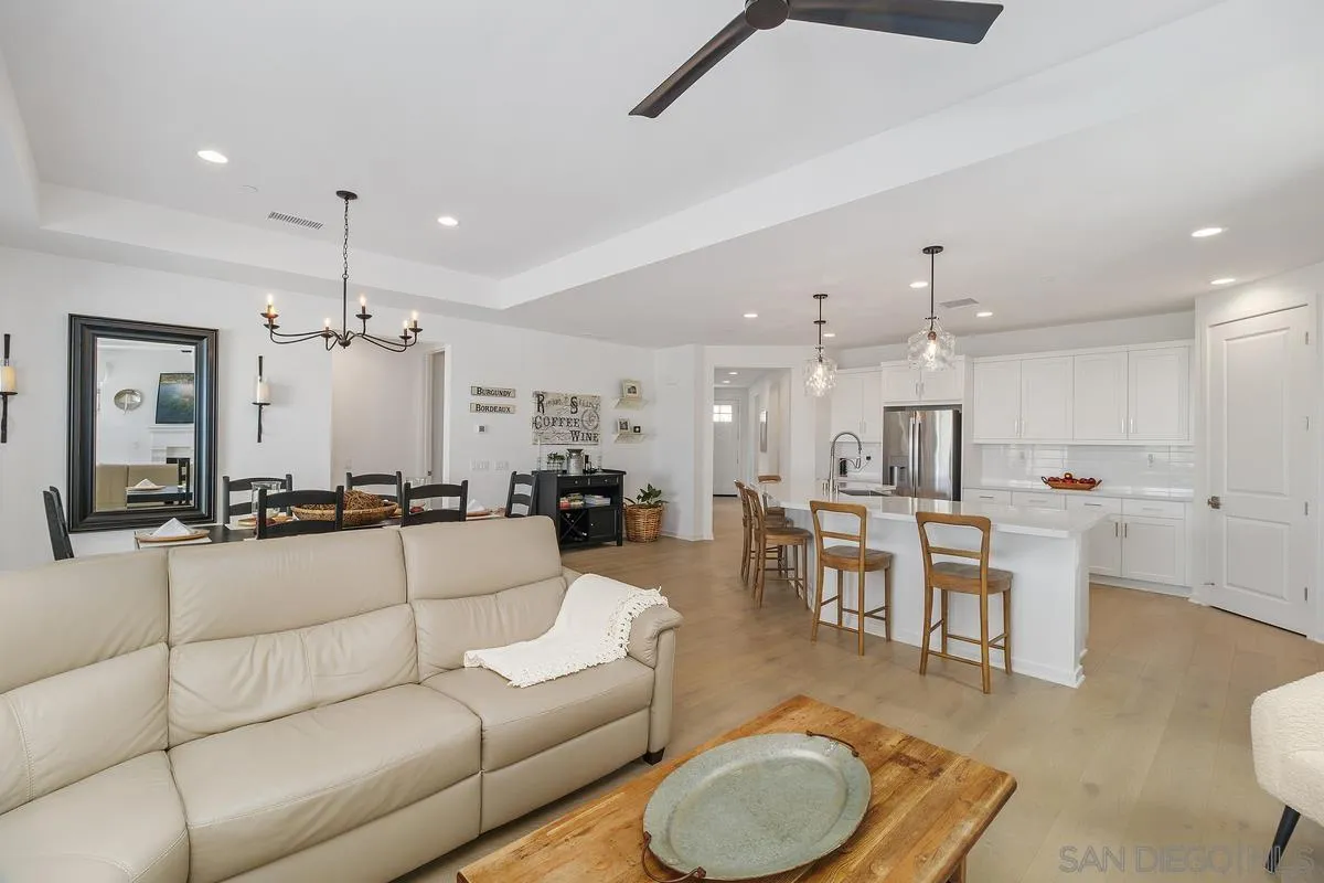 32082 Sedge Way Temecula, CA 92591 - Photo 9 of 59 a living room with furniture kitchen view and a wooden floor