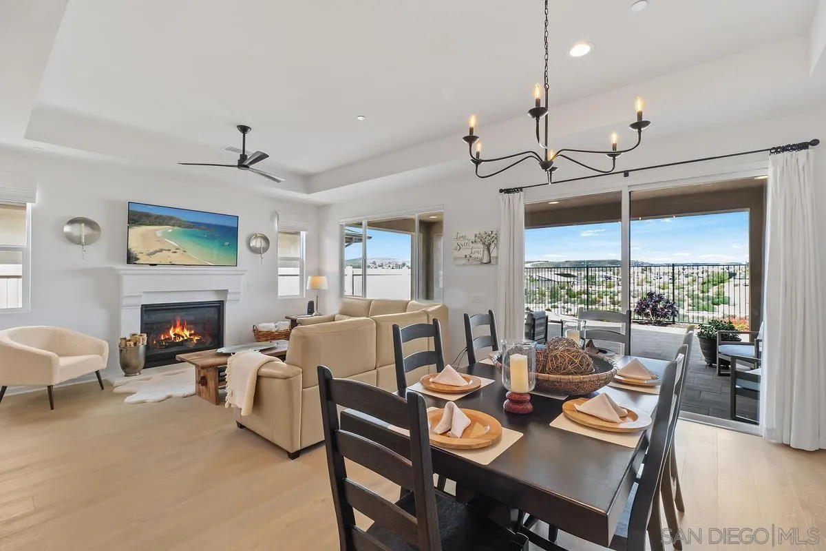 32082 Sedge Way Temecula, CA 92591 - Photo 10 of 59 a living room with furniture a fireplace and a floor to ceiling window