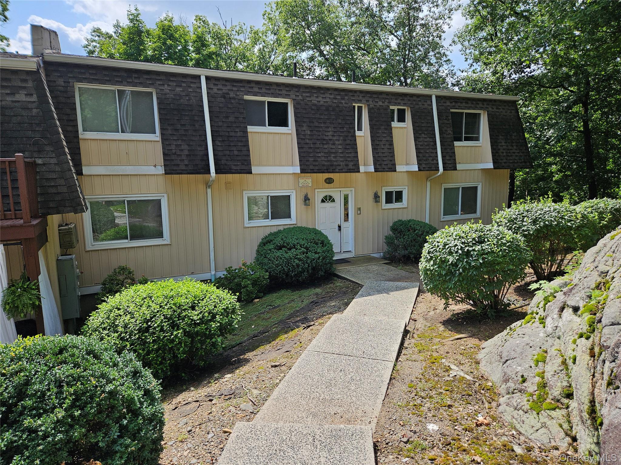 18 Pavilion Ridge Way, Unit 17 Suffern, NY 10901 - Photo 1 of 11 a house view with a garden space