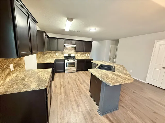 a view of a house with a yard and a garage