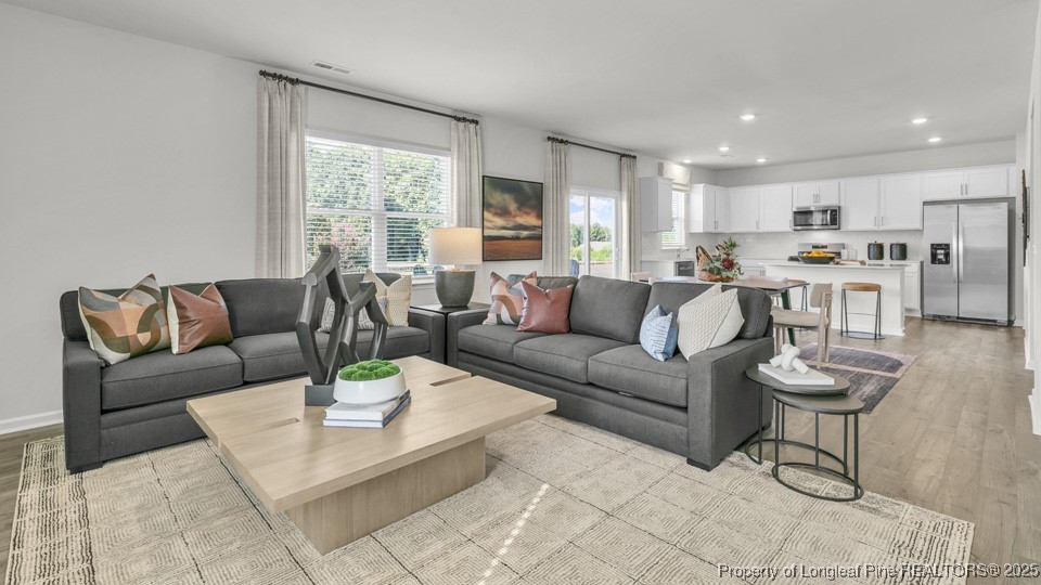 90 Discovery Way Spring Lake, NC 28390 - Photo 11 of 34 a living room with furniture and a large window