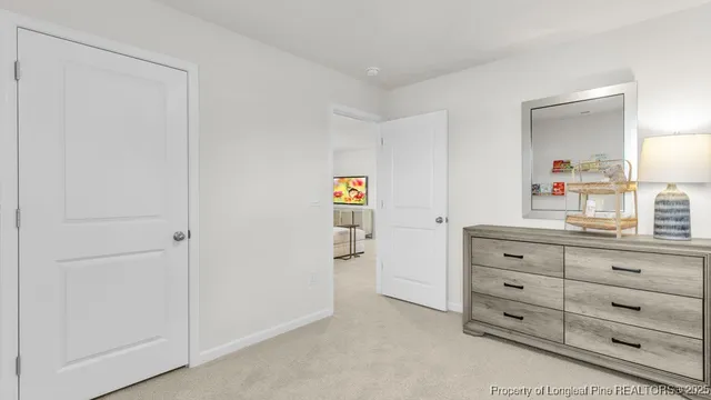 a room with a dresser and a mirror
