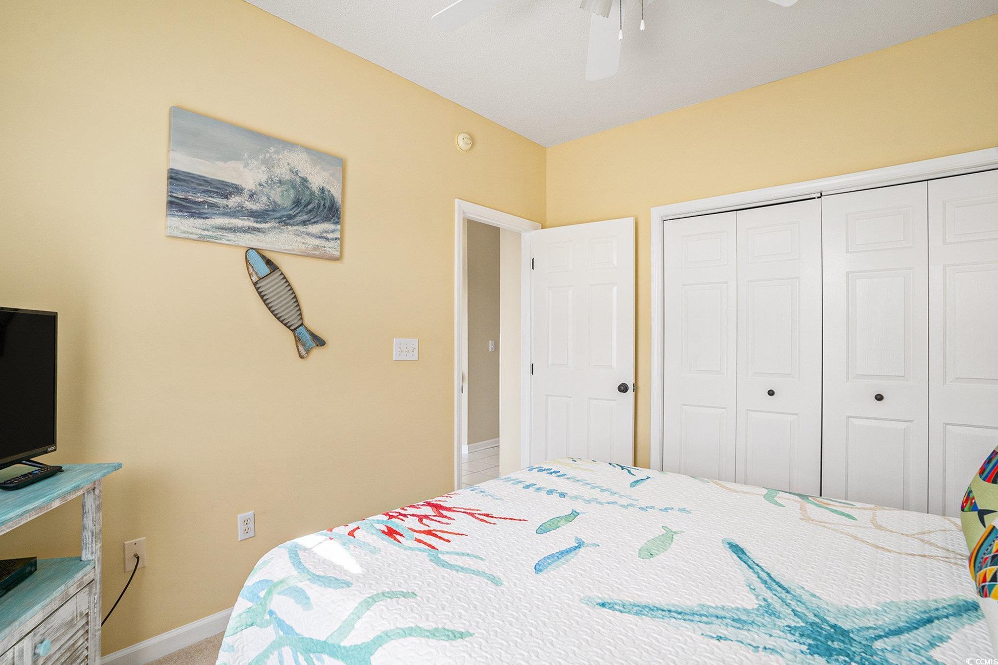 4459 Turtle Lane, Unit 3D Little River, SC 29566 - Photo 19 of 30 Bedroom featuring a ceiling fan and a closet