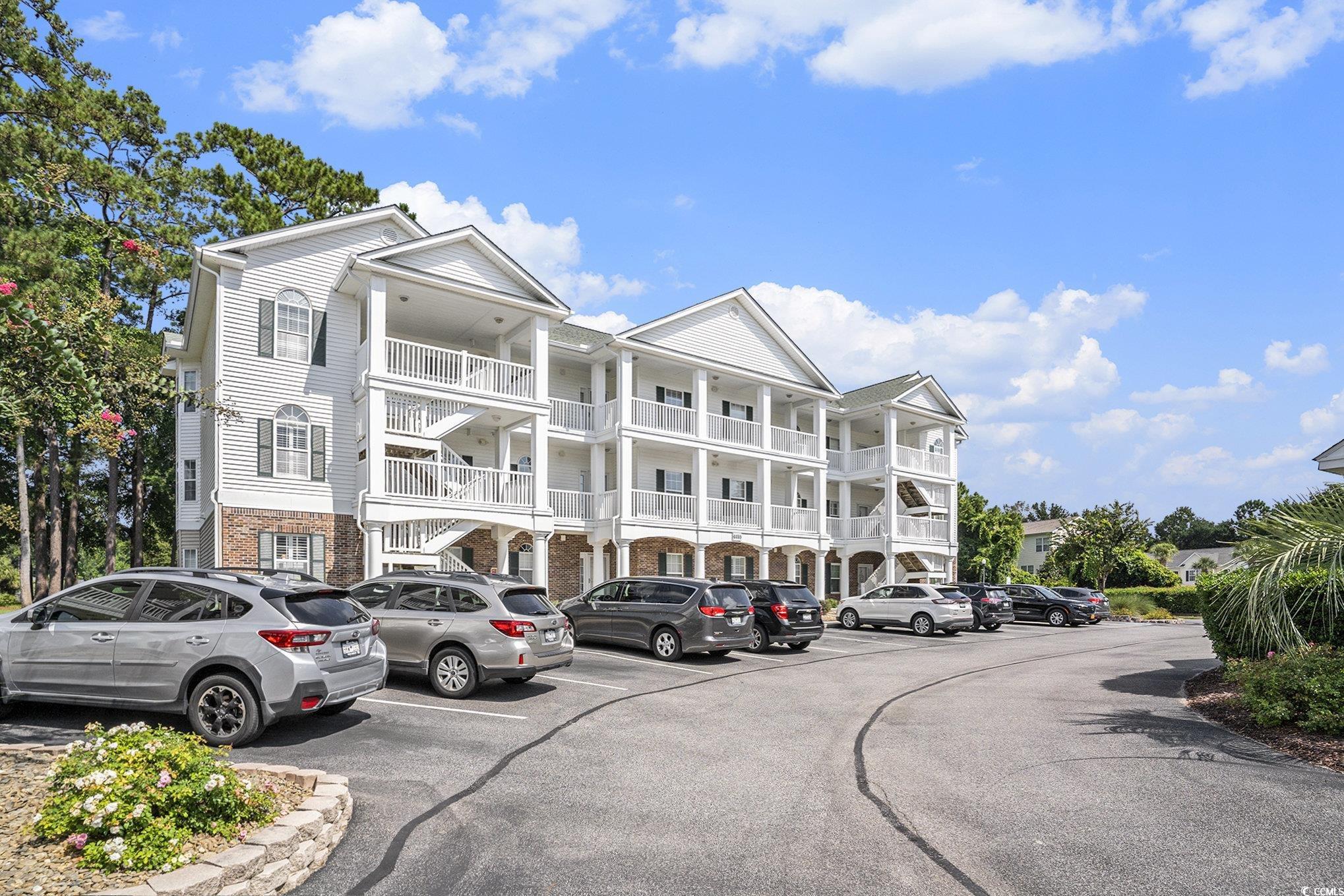 4459 Turtle Lane, Unit 3D Little River, SC 29566 - Photo 2 of 30 View of apartment building / complex with uncovered parking