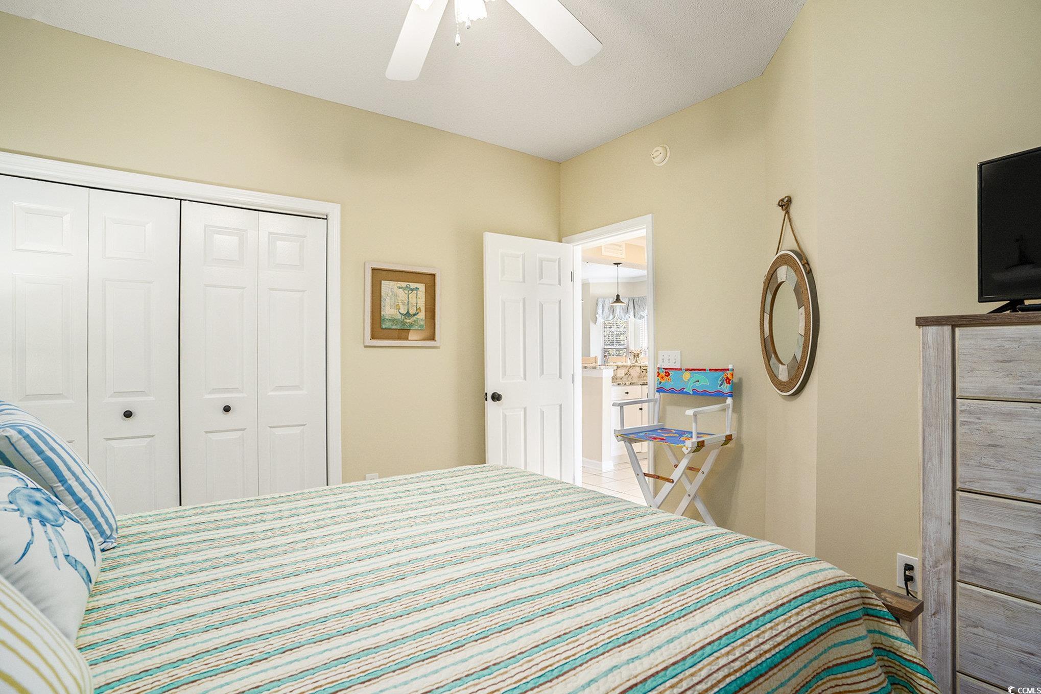 4459 Turtle Lane, Unit 3D Little River, SC 29566 - Photo 21 of 30 Bedroom featuring ceiling fan and a closet