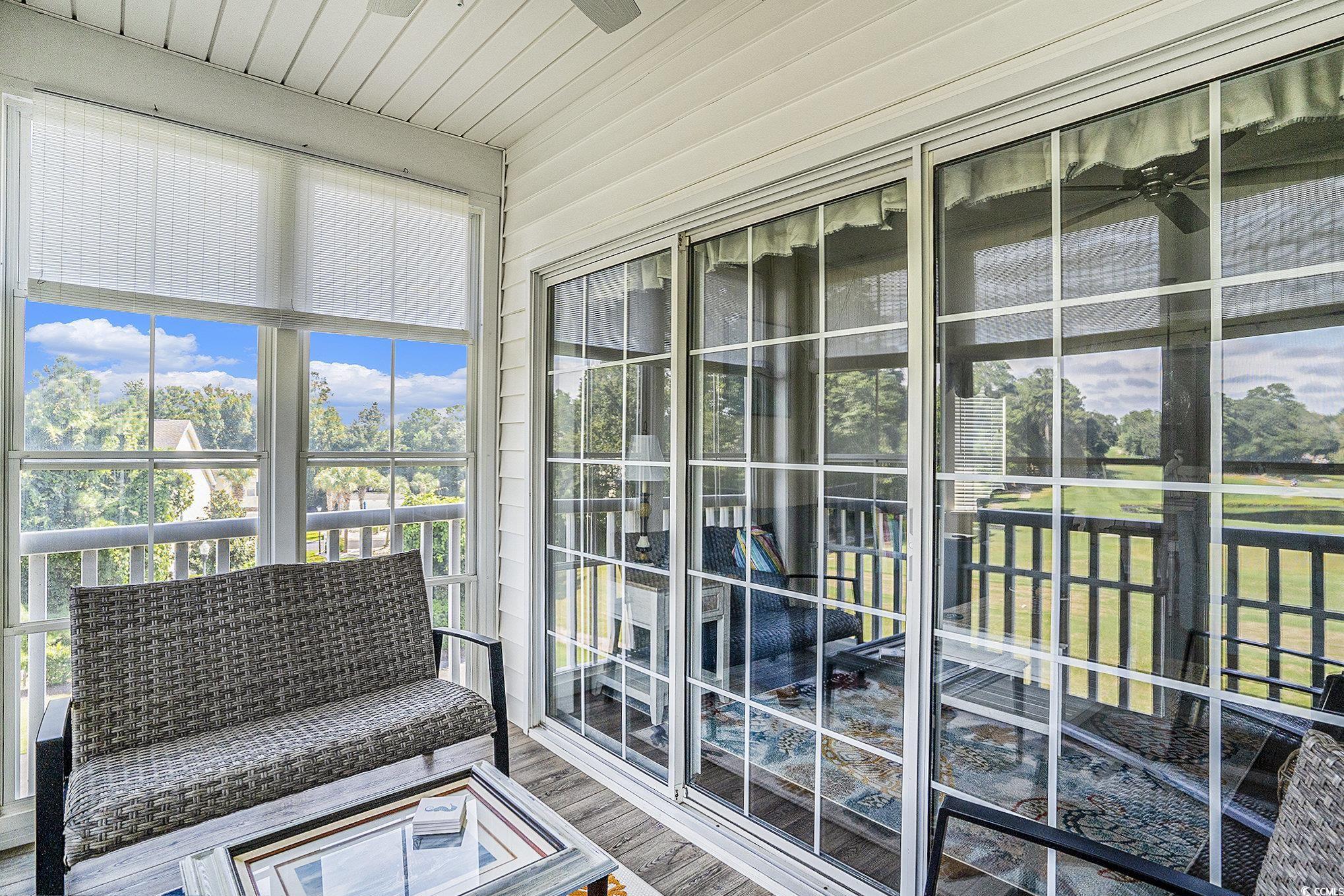 4459 Turtle Lane, Unit 3D Little River, SC 29566 - Photo 23 of 30 Sunroom with plenty of natural light and wood finished floors