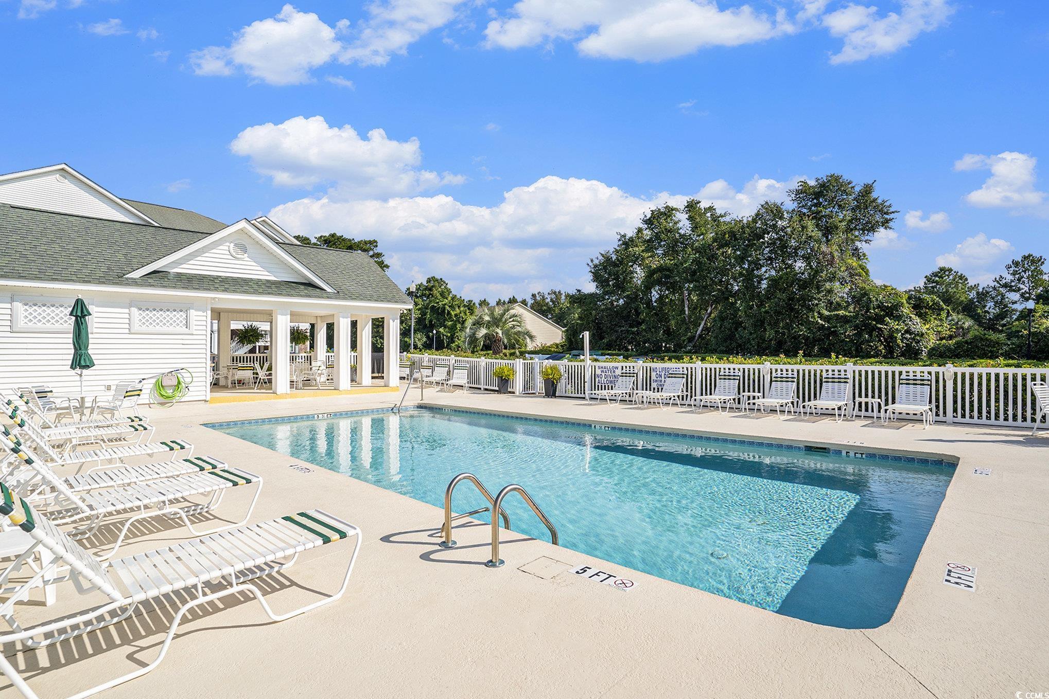 4459 Turtle Lane, Unit 3D Little River, SC 29566 - Photo 29 of 30 On-Site Community pool with a patio