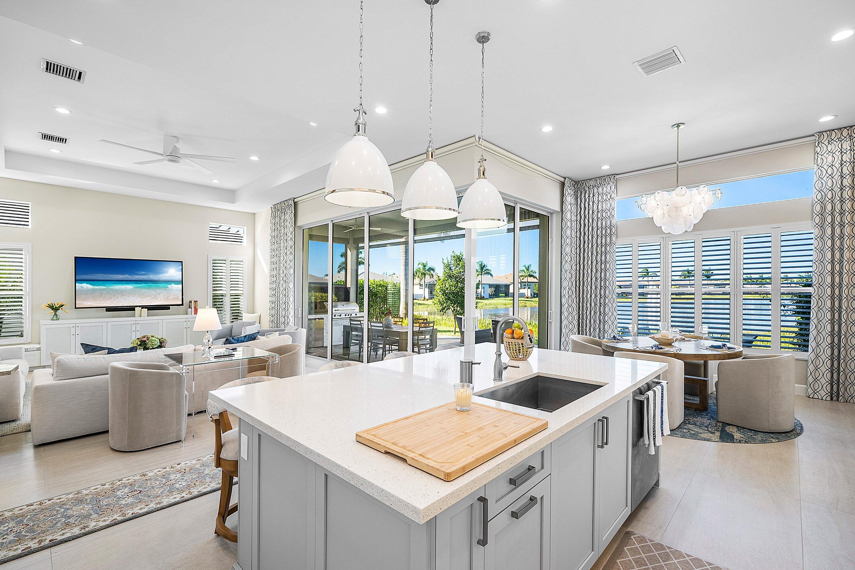 12626 Parrot Pond Road Boynton Beach, FL 33473 - Photo 17 of 67 a large white kitchen with a large window