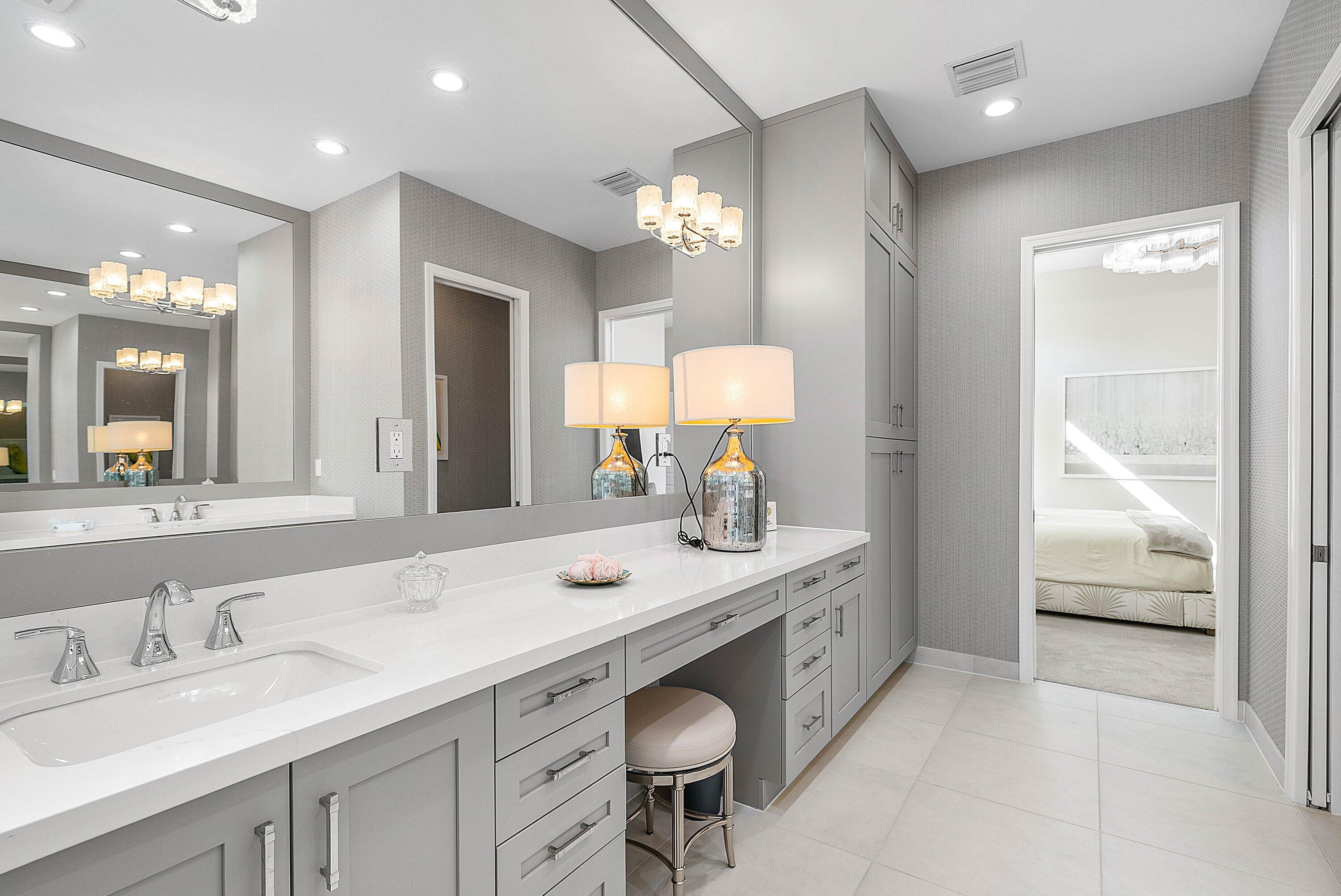 12626 Parrot Pond Road Boynton Beach, FL 33473 - Photo 33 of 67 a bathroom with a double vanity sink and a mirror